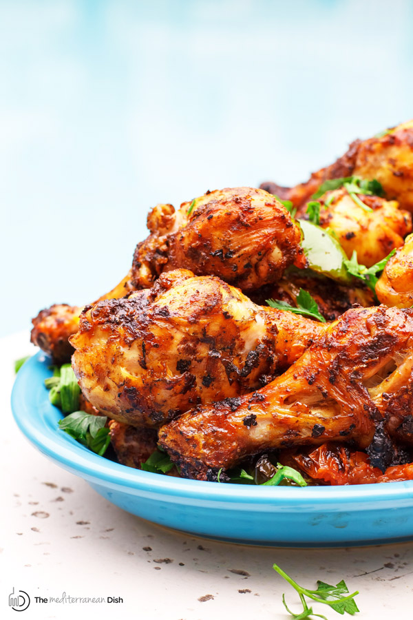 Grilled Chicken Drumsticks with Spicy Garlic Harissa Marinade