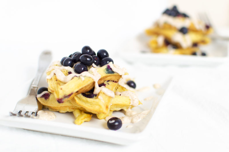 Who wouldn't want to wake up to these fluffy blueberry waffles?! Drizzle the frosting when they're still super-hot, and enjoy with more fresh blueberries.