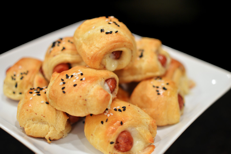 Cheesy Pigs in a Blanket from www.thatsquareplate.com These are to die for!