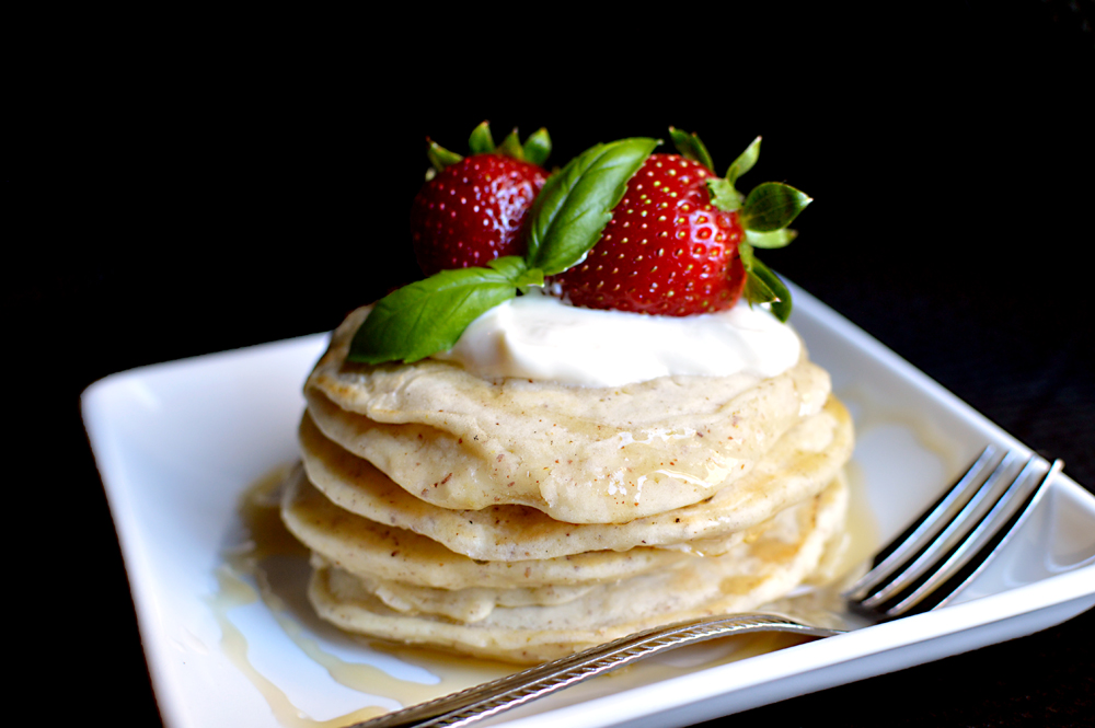 A simple, vegan pancake recipe made with almond milk and no egg. Serve with fresh berries and honey for a yummy, sweet, healthy start to your day!
